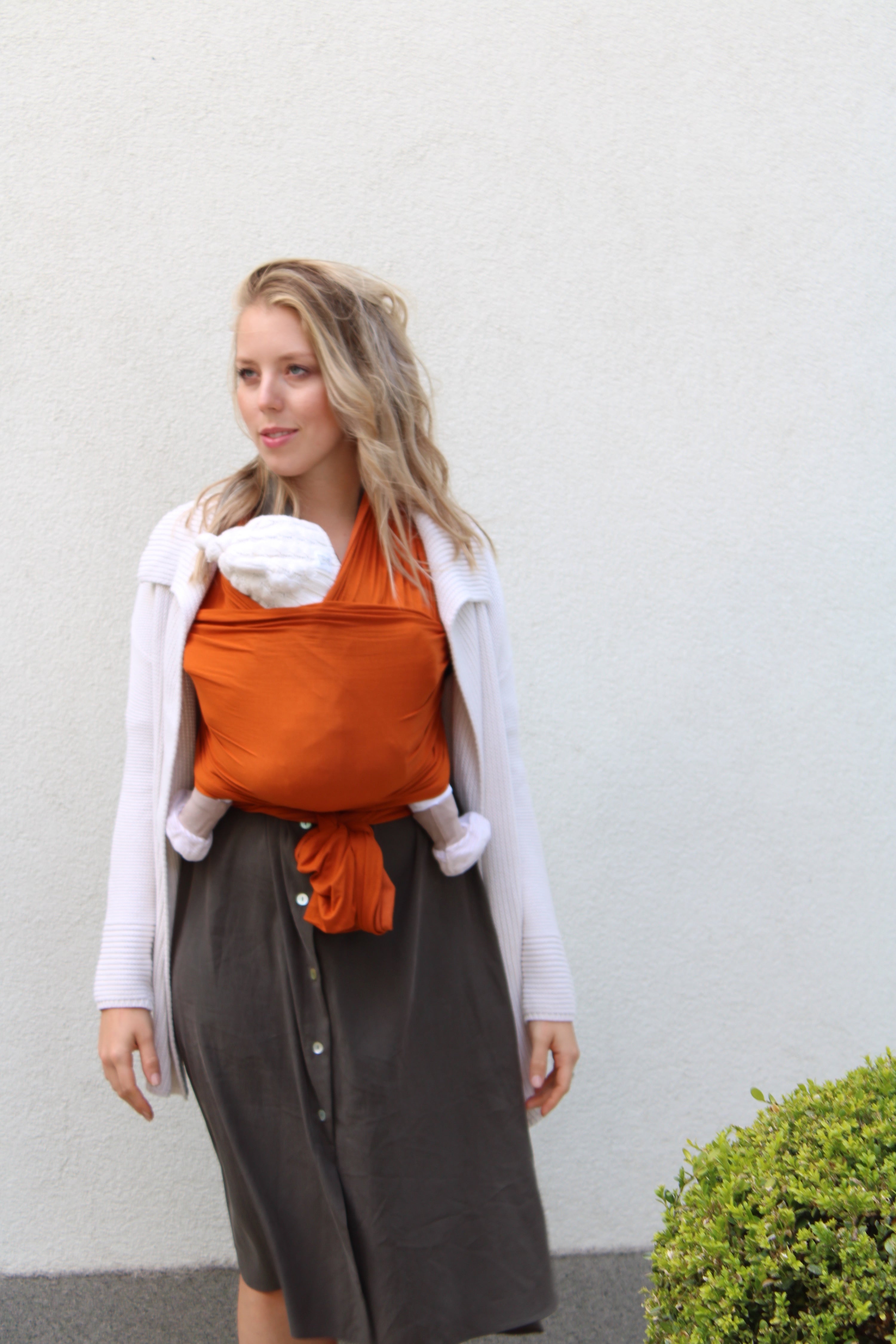 What are the benefits of wearing babies in a wrap?